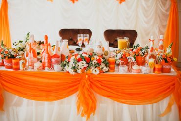 Orange wedding reception decor