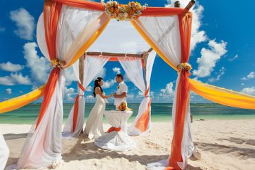Beach yellow wedding ceremony decor