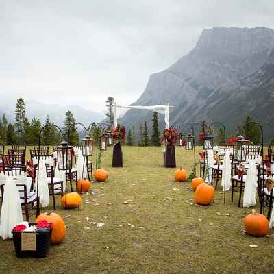 Outdoor autumn wedding ceremony decor